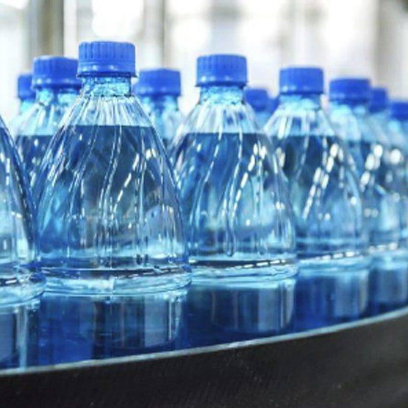 bottled water getting filled Water Bottles getting filled.